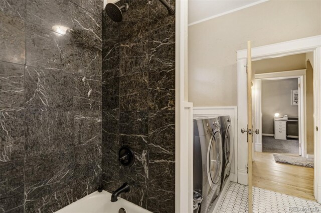 1510 S Cascade Ave, Colorado Springs, CO 80905 - bathroom featuring washer / clothes dryer, washtub / shower combination, and ornamental molding
