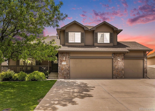 9650 Raven St, Firestone, CO 80504 - view of front of property with stone siding, driveway, roof with shingles, and a yard