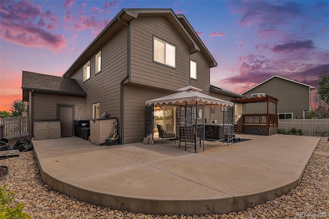 9650 Raven St, Firestone, CO 80504 - rear view of property featuring a patio area, fence, a gazebo, and a wooden deck