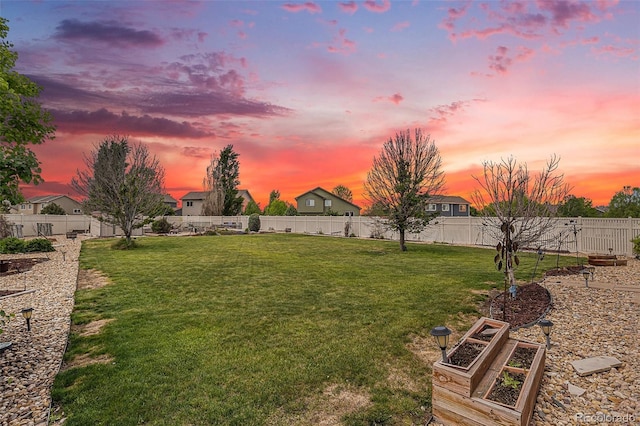 9650 Raven St, Firestone, CO 80504 - yard at dusk with a vegetable garden