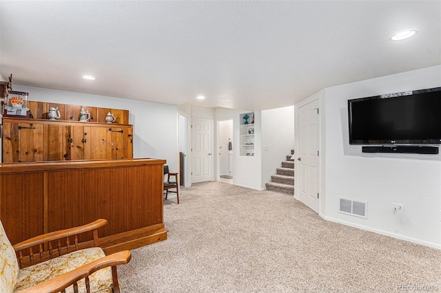9650 Raven St, Firestone, CO 80504 - sitting room featuring stairway, carpet floors, recessed lighting, and baseboards