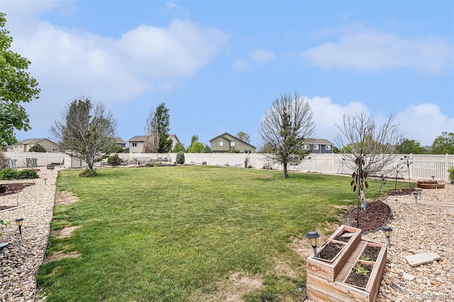 9650 Raven St, Firestone, CO 80504 - view of yard featuring a vegetable garden and a residential view