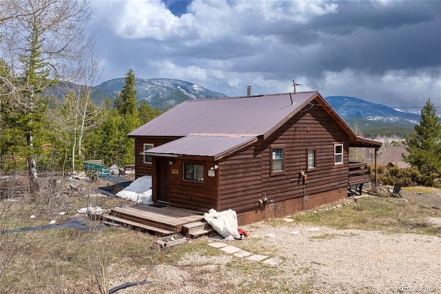 479 County Road 465, Grand Lake, CO 80447 - back of house with metal roof and a deck with mountain view