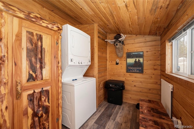 479 County Road 465, Grand Lake, CO 80447 - laundry room featuring stacked washer / dryer, wood finished floors, wood walls, and wooden ceiling