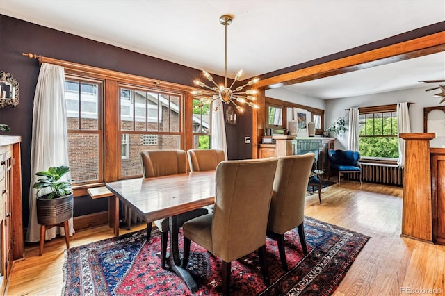 3145 W 31st Ave, Denver, CO 80211 - dining room featuring a chandelier, light wood finished floors, and beam ceiling