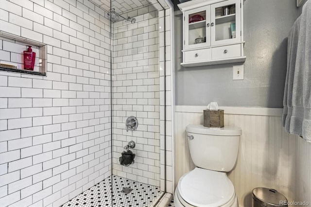 3145 W 31st Ave, Denver, CO 80211 - bathroom featuring a stall shower and a wainscoted wall