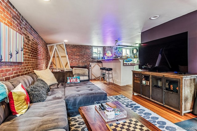 3145 W 31st Ave, Denver, CO 80211 - living area featuring brick wall, wood finished floors, and recessed lighting