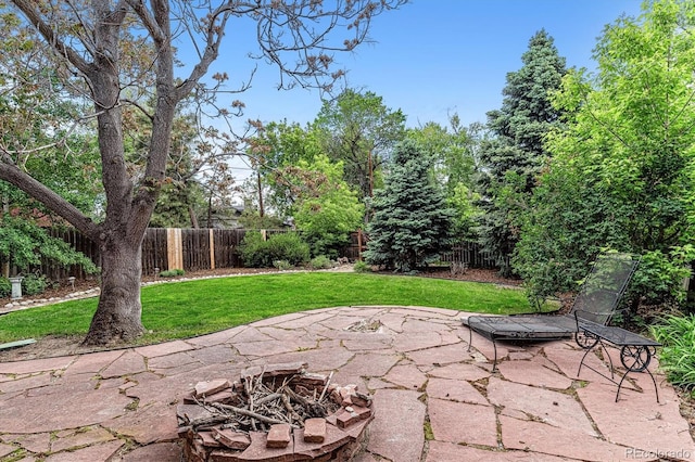 3145 W 31st Ave, Denver, CO 80211 - fenced backyard featuring a fire pit and a patio