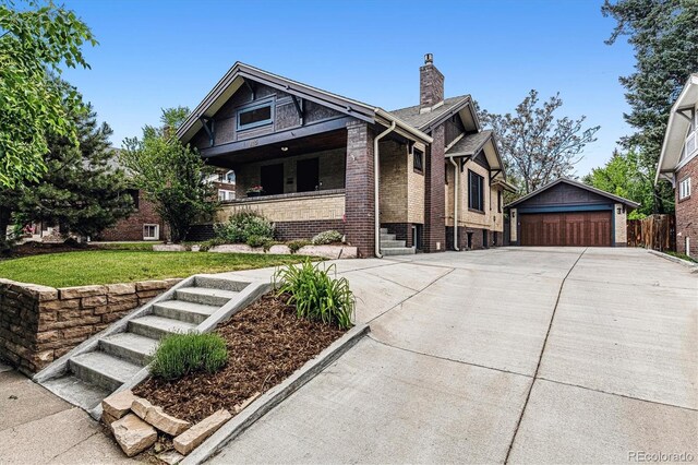 3145 W 31st Ave, Denver, CO 80211 - view of front of home featuring an outdoor structure, a garage, a chimney, covered porch, and brick siding
