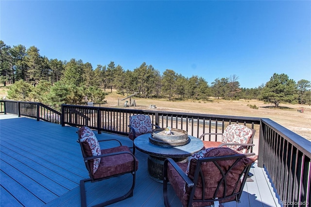 wooden deck featuring a fire pit