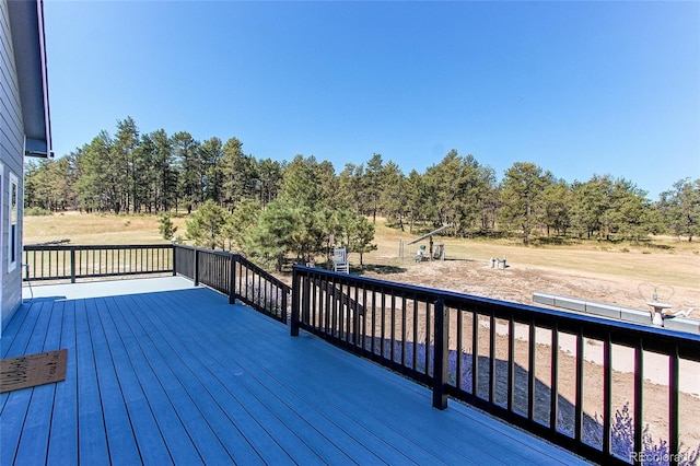 wooden deck featuring a fire pit