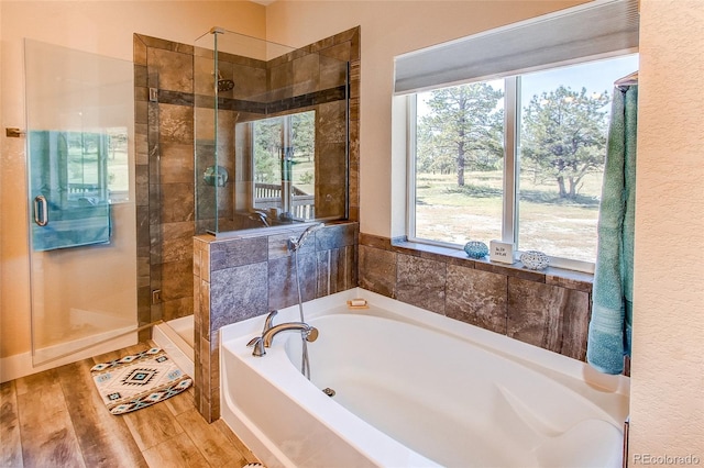 bathroom with separate shower and tub