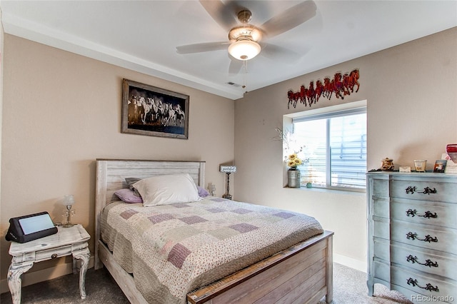 bedroom featuring ceiling fan and carpet