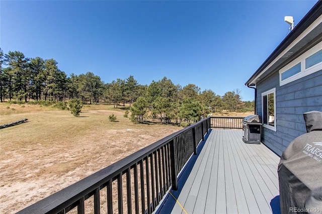 wooden terrace featuring area for grilling