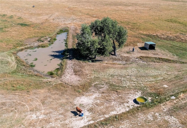 birds eye view of property with a rural view