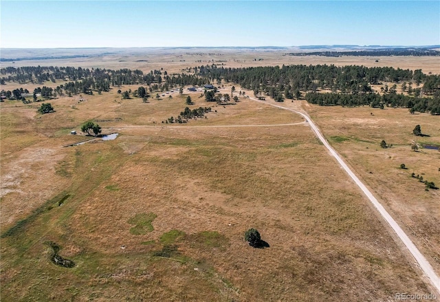 birds eye view of property with a rural view