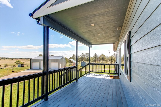 18050 Wedemeyer Rd, Kiowa, CO 80117 - wooden terrace featuring an outdoor structure and a yard