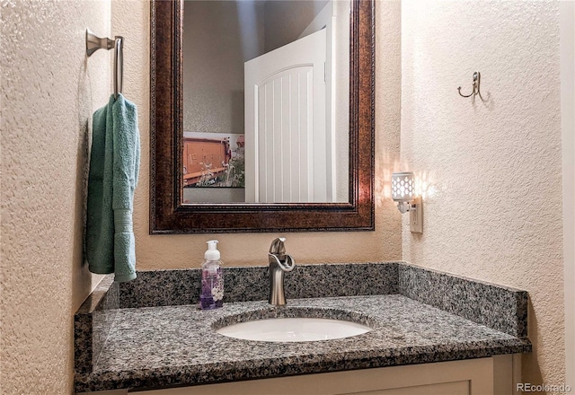 18050 Wedemeyer Rd, Kiowa, CO 80117 - bathroom with a textured wall and vanity
