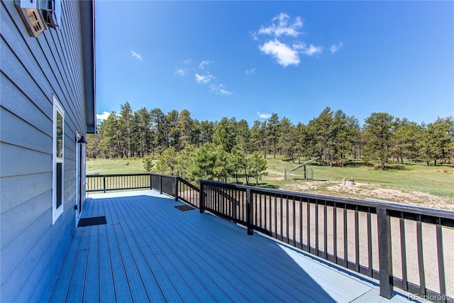 18050 Wedemeyer Rd, Kiowa, CO 80117 - wooden deck featuring view of wooded area