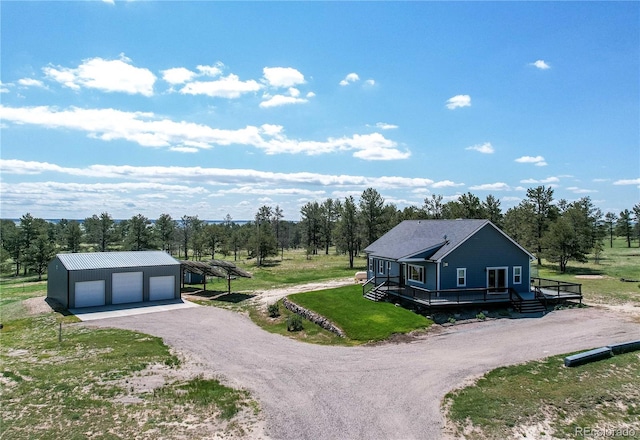 18050 Wedemeyer Rd, Kiowa, CO 80117 - view of home's exterior featuring a garage, an outdoor structure, a yard, view of scattered trees, and a deck