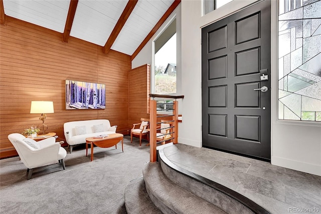 30334 Roan Dr, Evergreen, CO 80439 - entrance foyer with wooden walls, beamed ceiling, and high vaulted ceiling