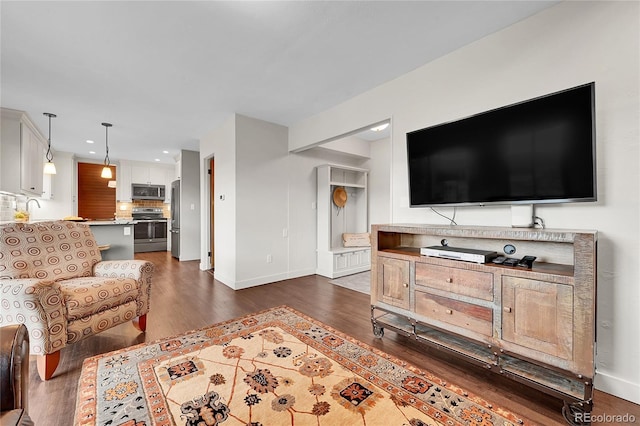 30334 Roan Dr, Evergreen, CO 80439 - living room with dark wood-style flooring and recessed lighting