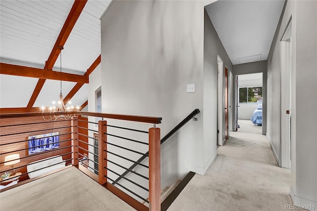 30334 Roan Dr, Evergreen, CO 80439 - corridor featuring an upstairs landing, carpet, and a chandelier