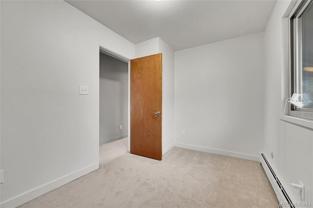 30334 Roan Dr, Evergreen, CO 80439 - spare room with a baseboard radiator and light colored carpet