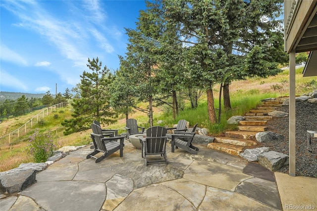 30334 Roan Dr, Evergreen, CO 80439 - view of patio featuring a fire pit and stairway