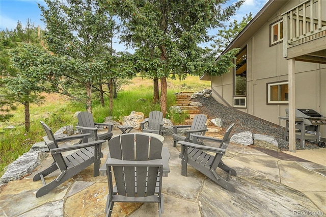 30334 Roan Dr, Evergreen, CO 80439 - view of patio / terrace with a fire pit and a grill