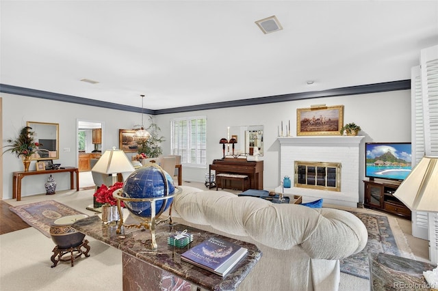 2800 S University Blvd Unit 174, Denver, CO 80210 - living room featuring ornamental molding, a brick fireplace, and wood finished floors