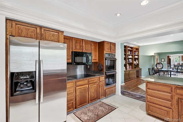 2800 S University Blvd Unit 174, Denver, CO 80210 - kitchen with black appliances, brown cabinets, light tile patterned floors, crown molding, and recessed lighting