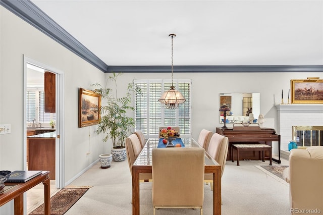 2800 S University Blvd Unit 174, Denver, CO 80210 - dining space with ornamental molding, light carpet, and a fireplace