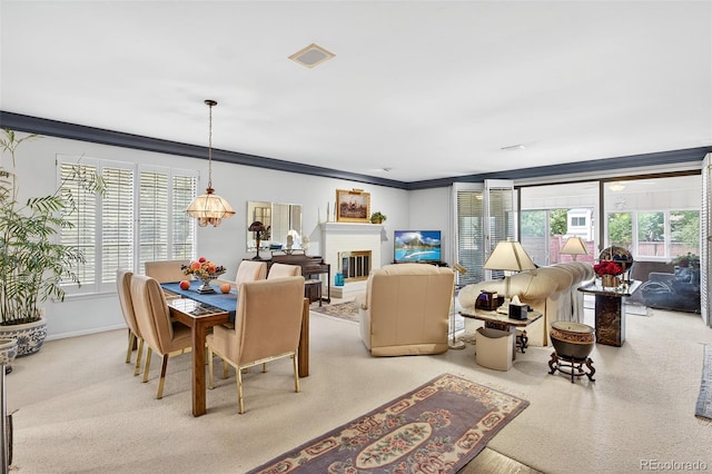 2800 S University Blvd Unit 174, Denver, CO 80210 - dining room featuring ornamental molding and a glass covered fireplace