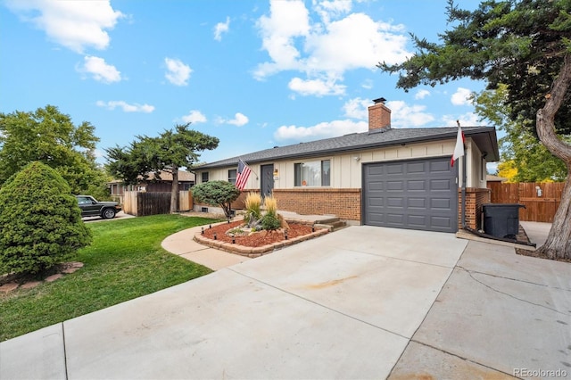 single story home featuring a garage and a front lawn