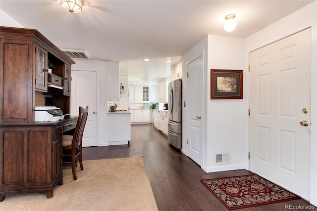 6666 S Pennsylvania St, Centennial, CO 80121 - kitchen with freestanding refrigerator, dark wood-style floors, recessed lighting, glass insert cabinets, and white cabinets