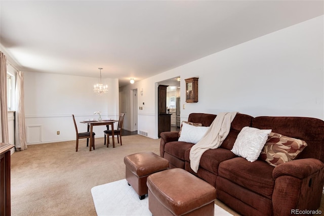 6666 S Pennsylvania St, Centennial, CO 80121 - living area featuring a chandelier and light colored carpet