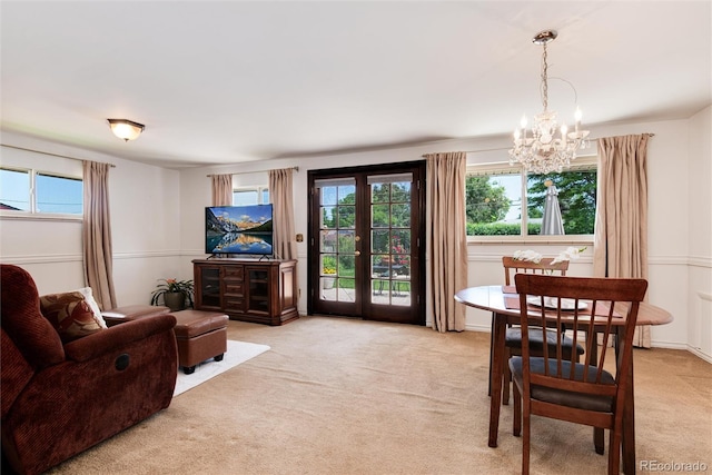 6666 S Pennsylvania St, Centennial, CO 80121 - living room featuring a chandelier, plenty of natural light, light carpet, and french doors