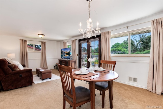 6666 S Pennsylvania St, Centennial, CO 80121 - dining room featuring a chandelier and light colored carpet