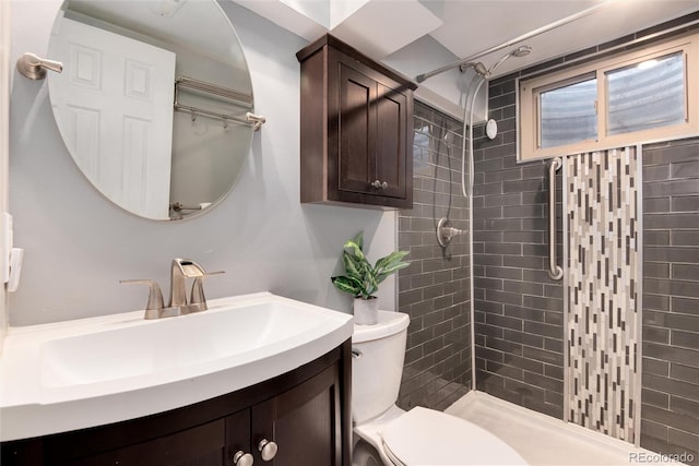 6666 S Pennsylvania St, Centennial, CO 80121 - bathroom featuring tiled shower and vanity