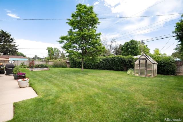 6666 S Pennsylvania St, Centennial, CO 80121 - fenced backyard featuring an exterior structure and an outbuilding