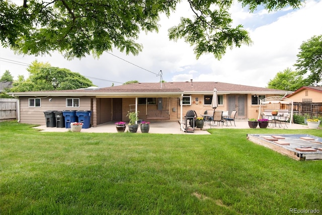 6666 S Pennsylvania St, Centennial, CO 80121 - rear view of house with a patio area