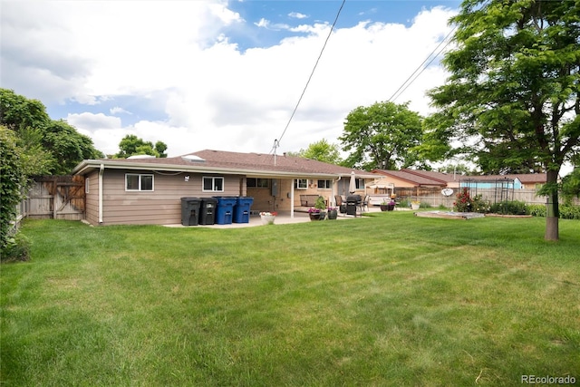 6666 S Pennsylvania St, Centennial, CO 80121 - rear view of house featuring a fenced backyard and a patio