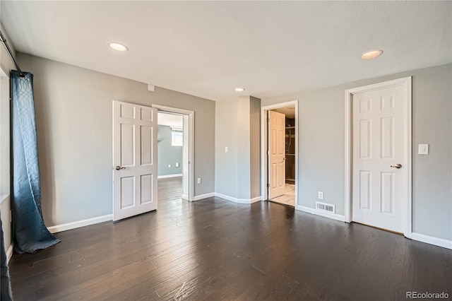 spare room featuring dark hardwood / wood-style floors