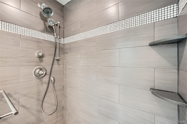 bathroom with a tile shower