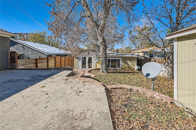 rear view of property featuring an outbuilding