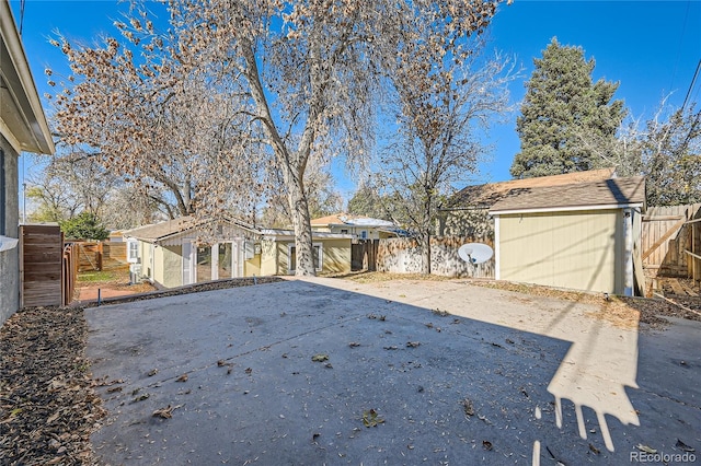 exterior space with a patio area and a storage unit