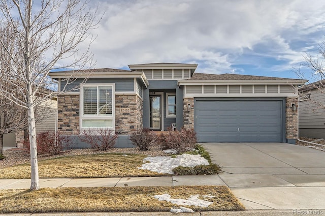 prairie-style house featuring a garage