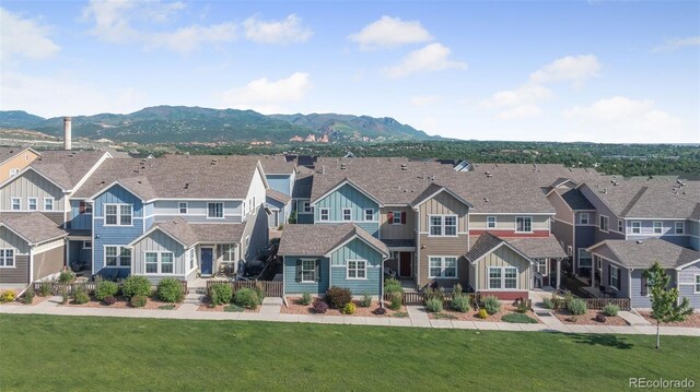 44 S Olympian Dr, Colorado Springs, CO 80905 - view of front of home with board and batten siding, a residential view, and a mountain view