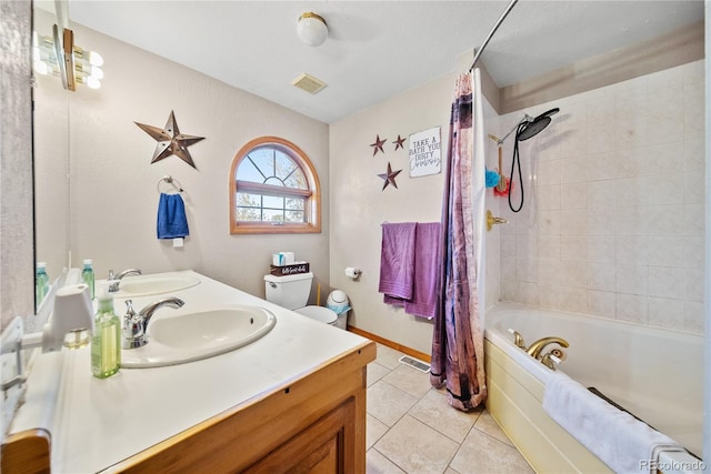 bathroom featuring tile patterned floors, vanity, and shower / tub combo with curtain